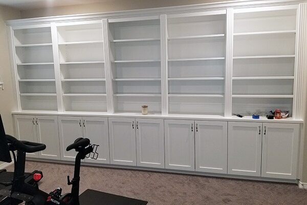 built-in wall unit, bookshelves and custom cabinets